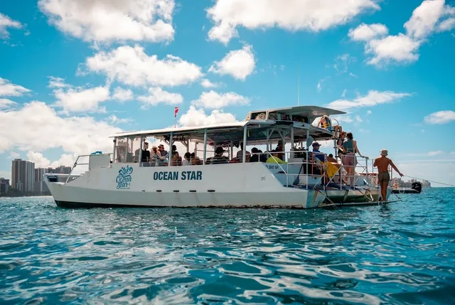 OceanStar boat with its wooden rooftop moored off Waikiki